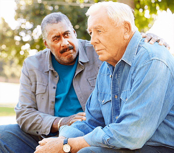 Man comforting another man